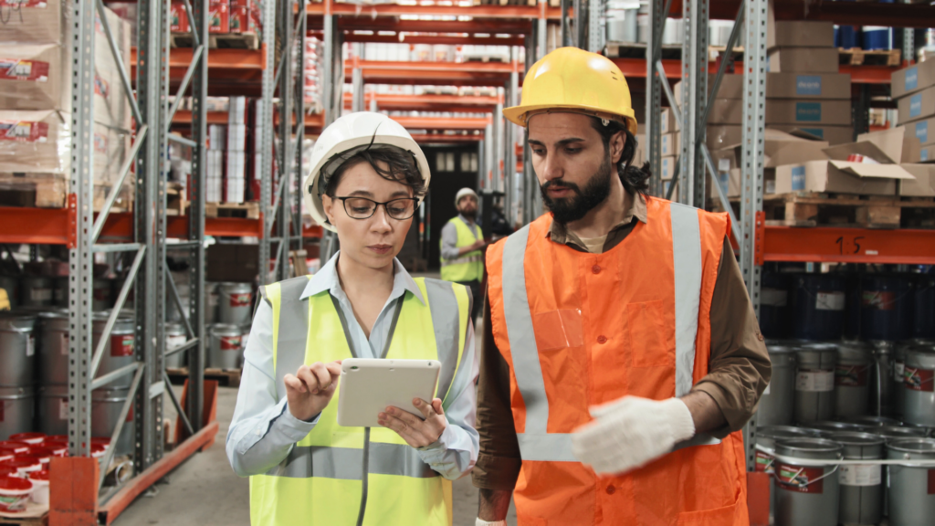 Warehouse staff validating inventory data and system processes during a WMS implementation and operational optimization effort.