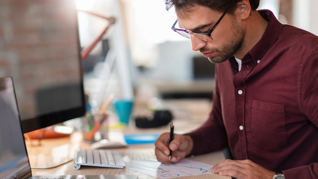 Operations lead reviewing a process diagram, representing client-side leadership in a WMS implementation.