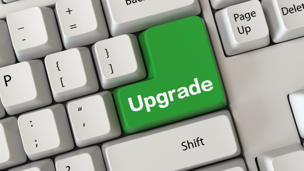 Green Upgrade key on a keyboard, symbolizing the benefits of upgrading a WMS instead of replacing it